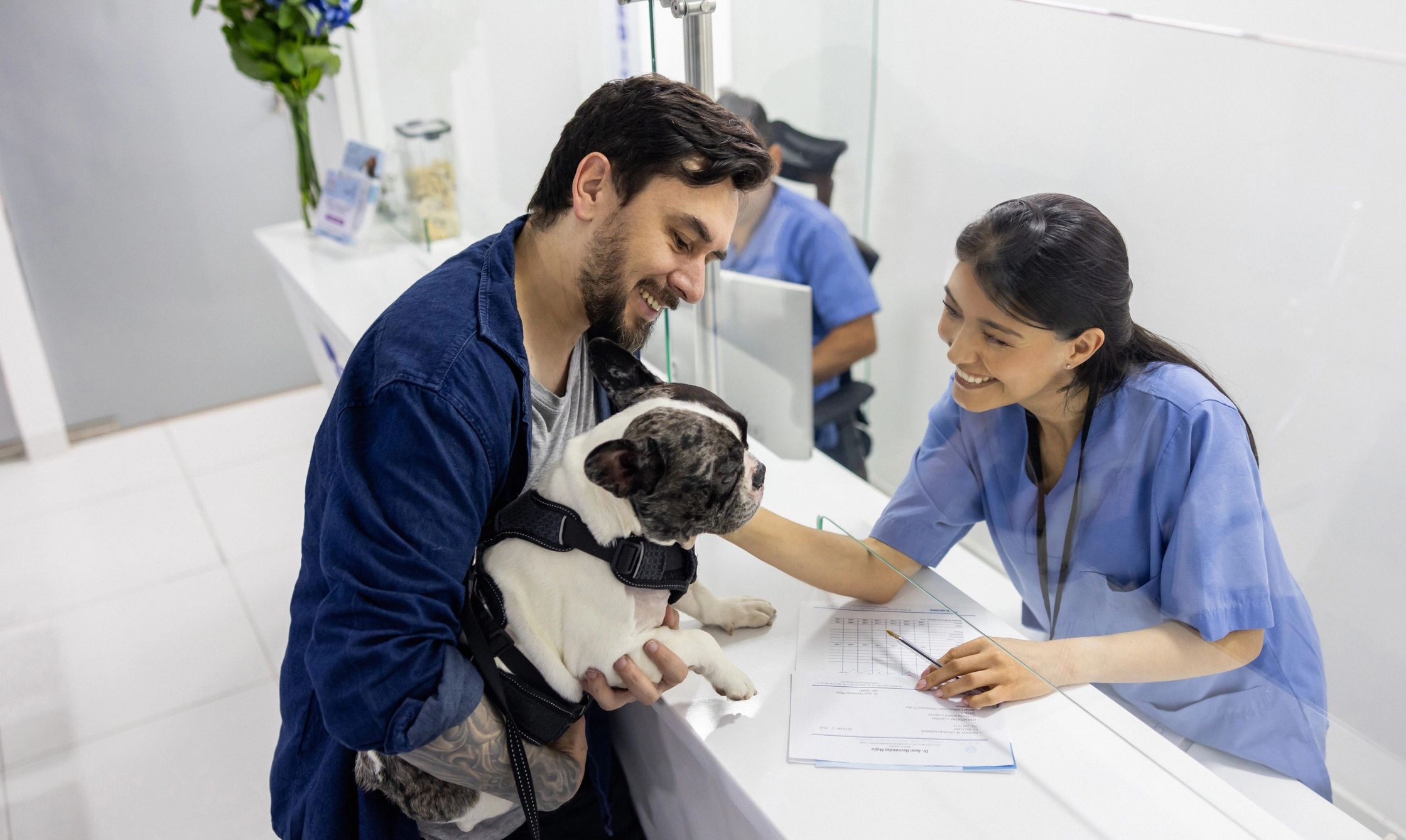 Pet owner filling out veterinary form